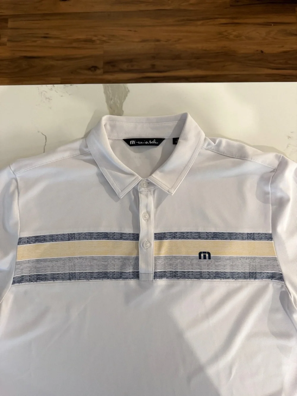 Travis Mathew White Polo with Navy and Yellow Stripes - Picture 4 of 5